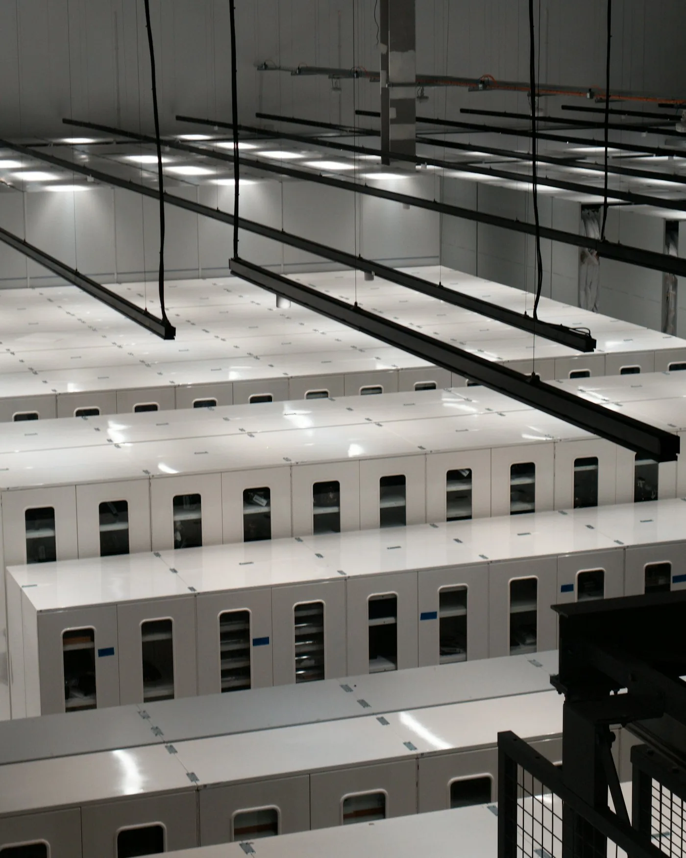 Rows of server cabinets in a modern data center.