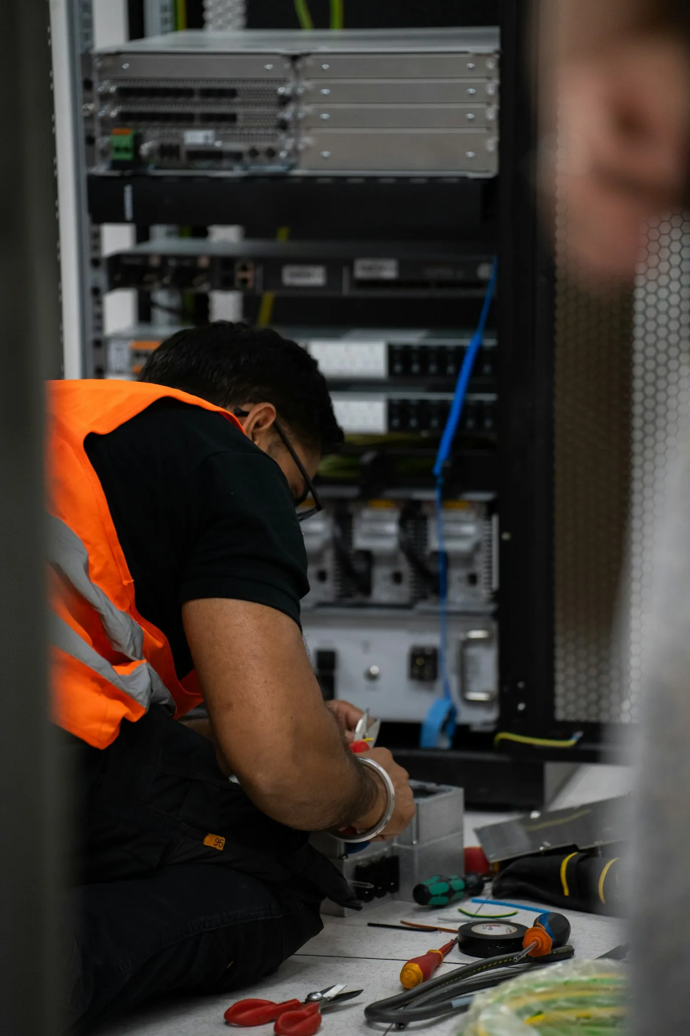 A technician working on server equipment.