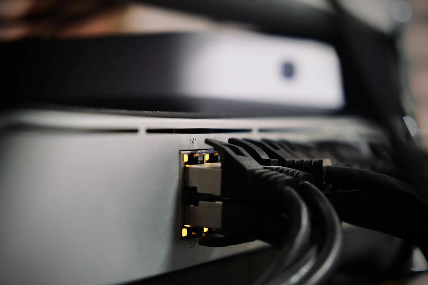 Ethernet cables connecting to a network device.