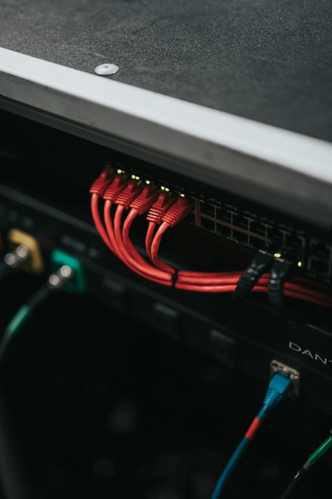 Red network cables connected to a switch.