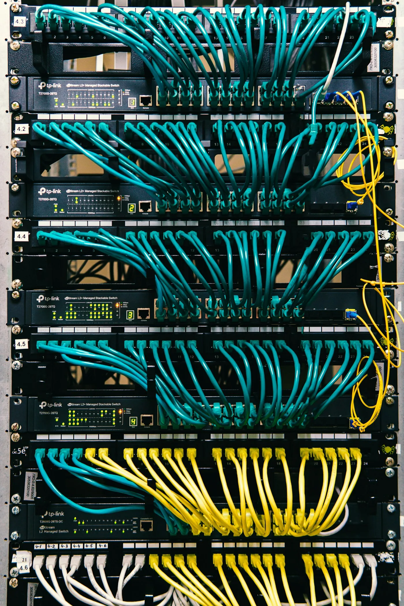 A network rack with organized cables and switches.