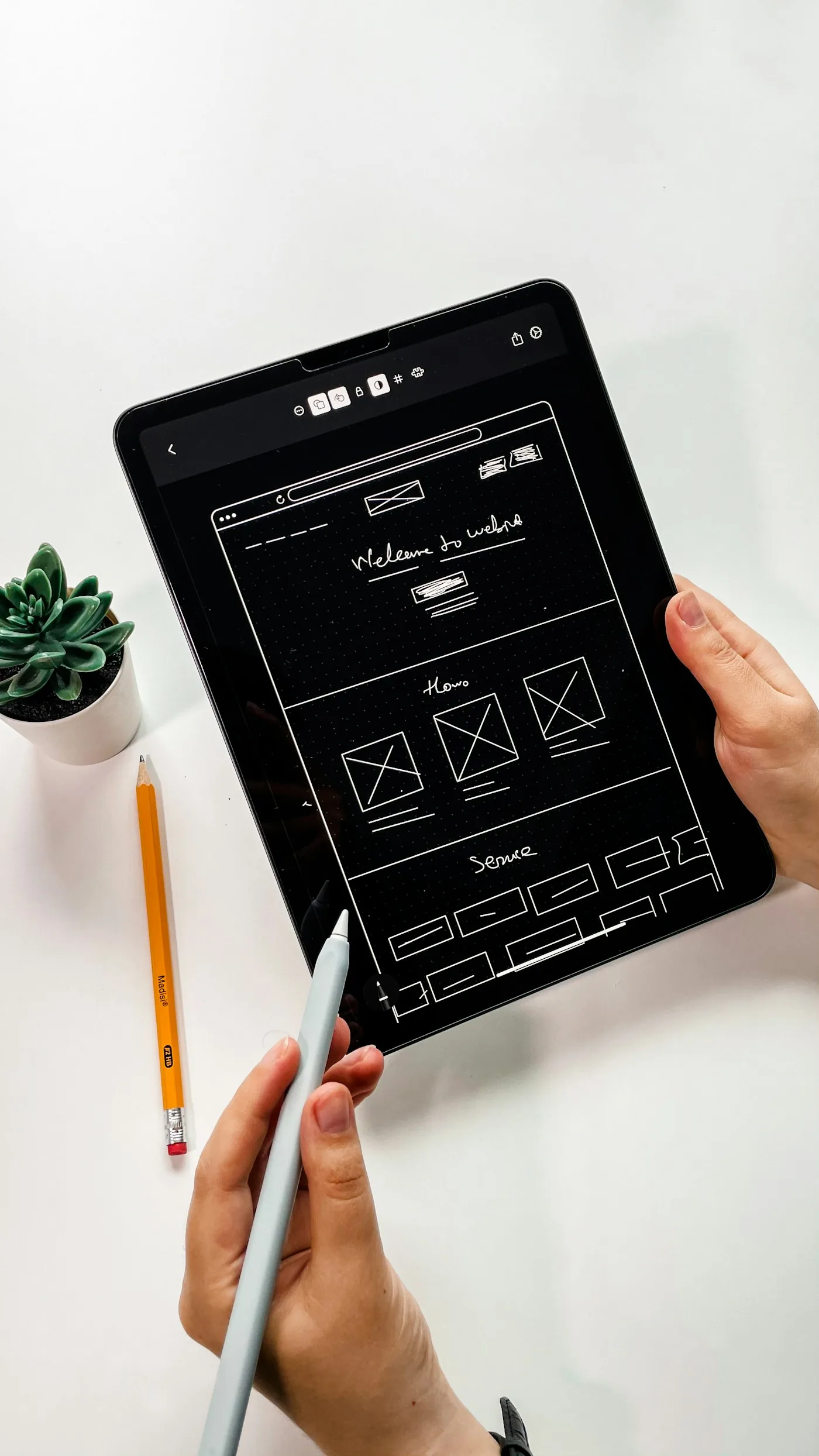 An application wireframe displayed on a tablet.