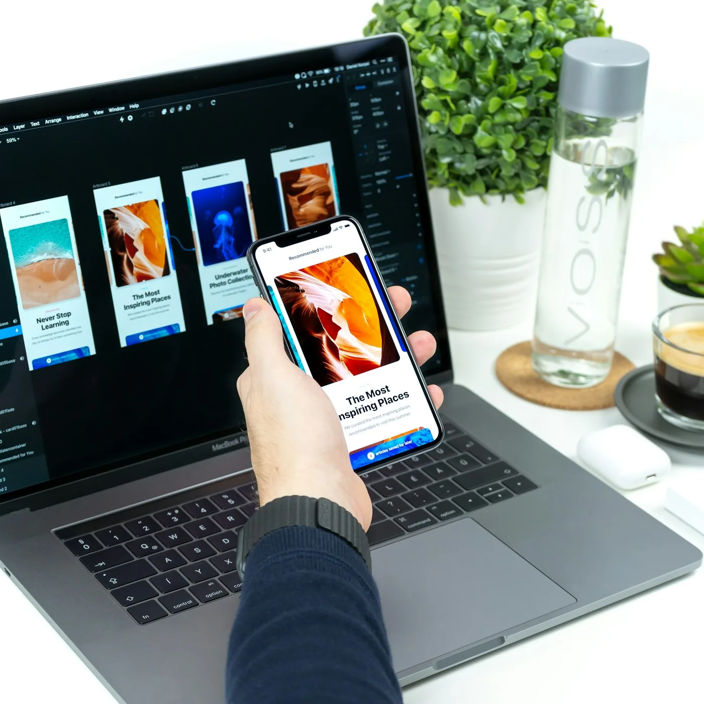 A person comparing an application on mobile and desktop screens.