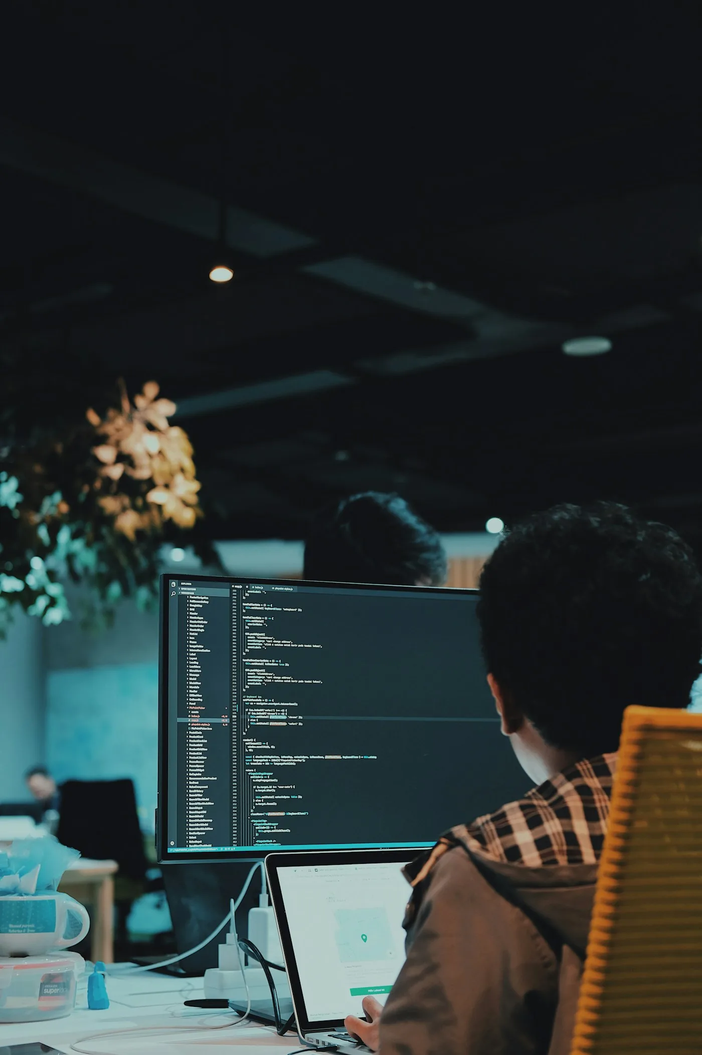 A developer reviewing source code on a monitor.